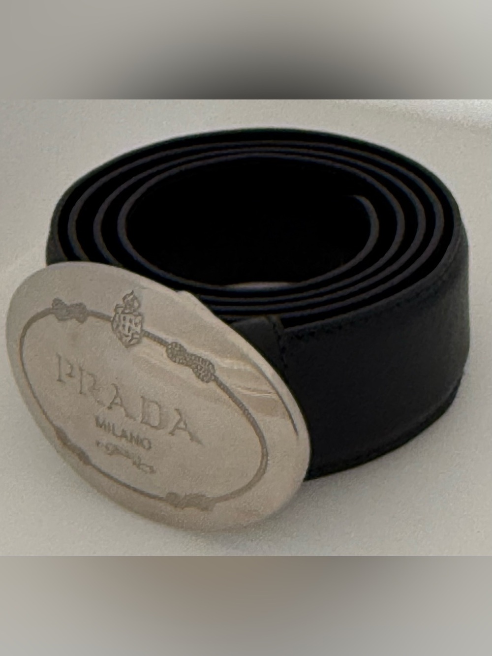 Prada women’s Black Leather Belt with Oval Silver Logo Buckle